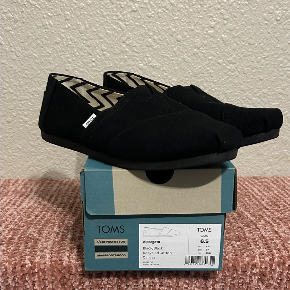 TOMS Black Canvas Slip-Ons
